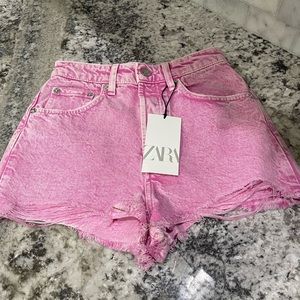 Denim cut off shorts. Pink wash. New with tags